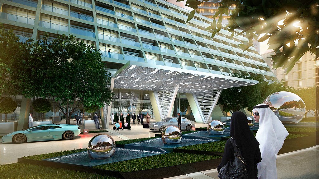 A group of people in graduation gowns standing outside a building.